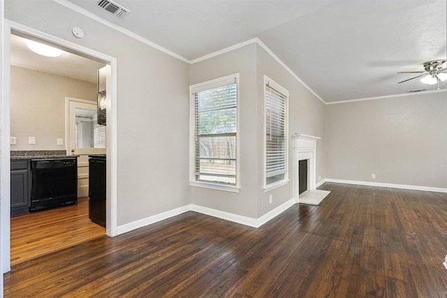 unfurnished living room with crown molding, a ceiling fan, dark wood-style floors, and visible vents