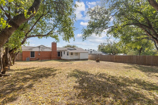 single story home featuring a garage and a front yard