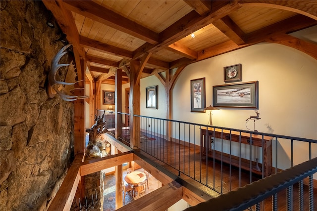 hall featuring wood ceiling and beamed ceiling