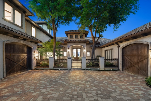 mediterranean / spanish house featuring a garage