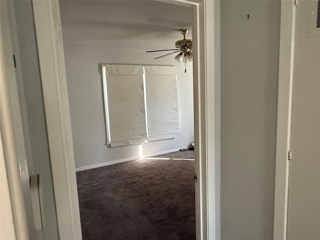 hallway with carpet flooring