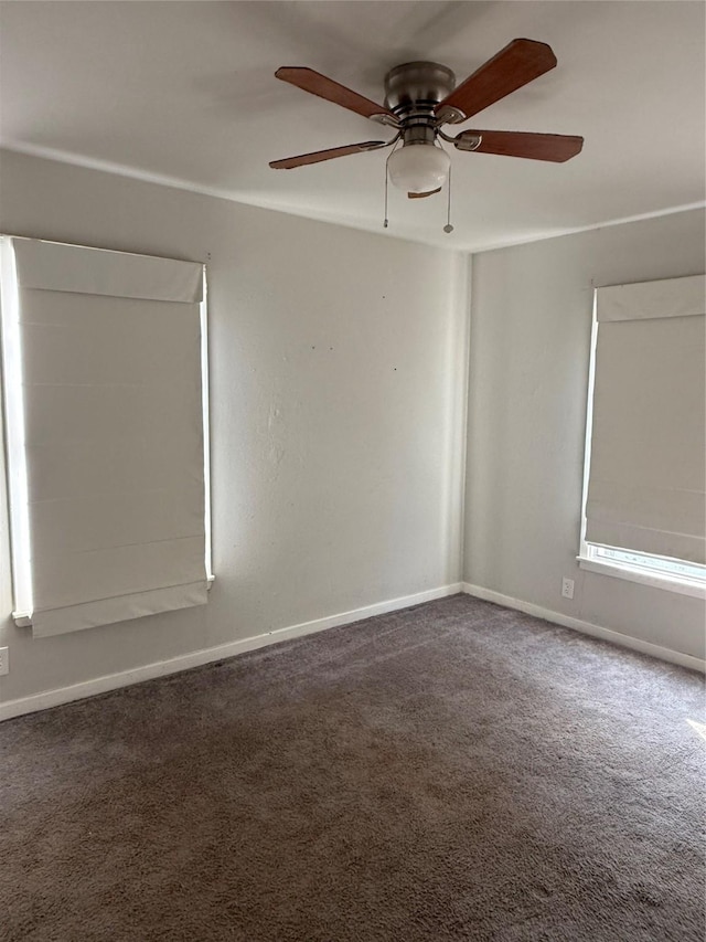 carpeted spare room with ceiling fan