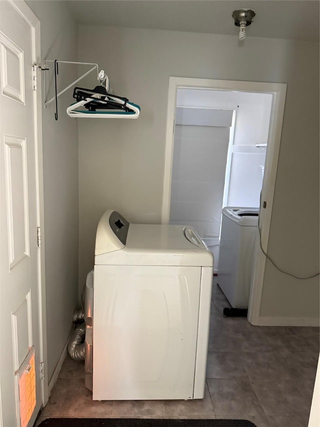 washroom with washer and dryer