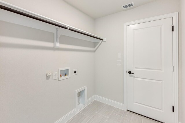 washroom featuring hookup for a gas dryer, hookup for an electric dryer, and washer hookup