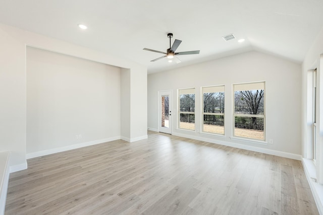 unfurnished living room featuring vaulted ceiling, ceiling fan, and light hardwood / wood-style flooring