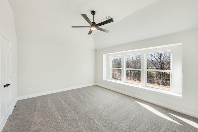 unfurnished room with vaulted ceiling, ceiling fan, and carpet