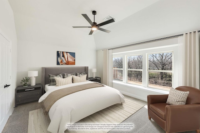 bedroom featuring lofted ceiling, carpet floors, and ceiling fan