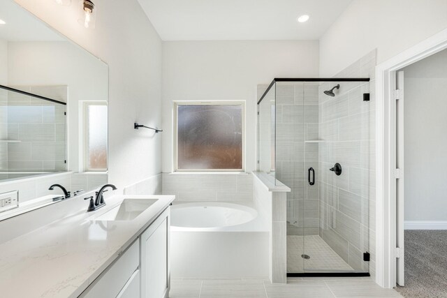 bathroom with vanity, tile patterned floors, and independent shower and bath