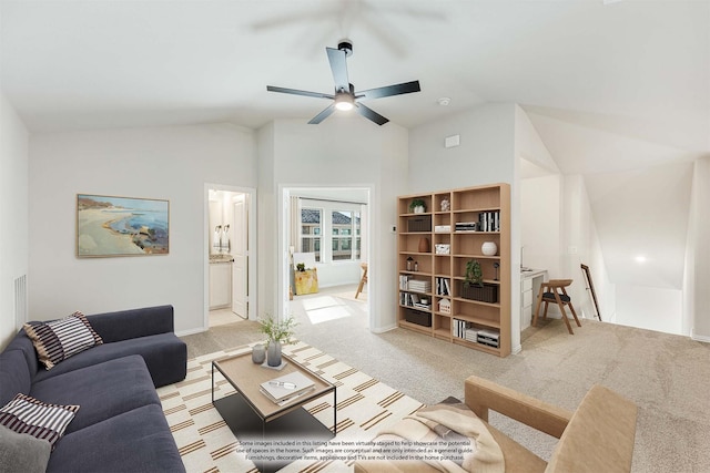 carpeted living room with lofted ceiling and ceiling fan