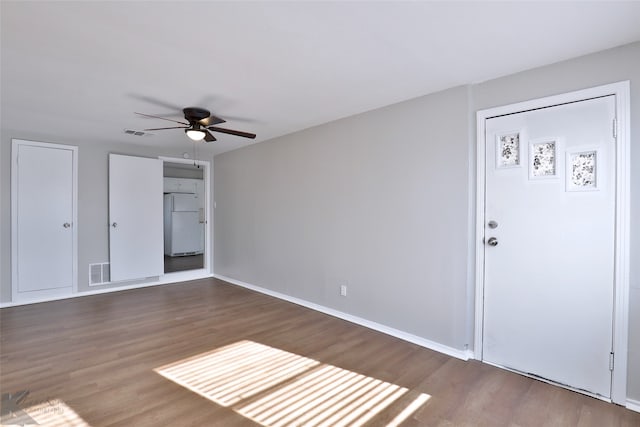 entryway with hardwood / wood-style flooring and ceiling fan