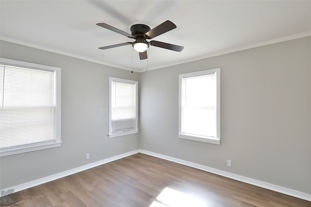 empty room with ornamental molding, light hardwood / wood-style flooring, and ceiling fan