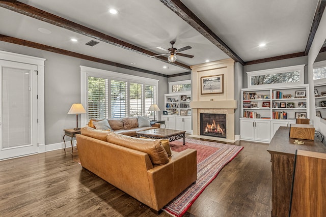 living room with beamed ceiling, dark wood-type flooring, and ceiling fan