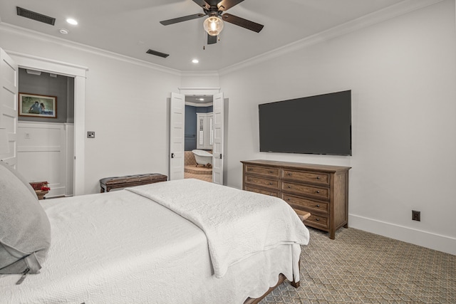 carpeted bedroom with connected bathroom, crown molding, and ceiling fan