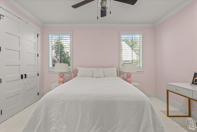 bedroom with light carpet, multiple windows, crown molding, and ceiling fan