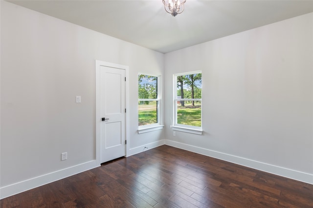 spare room featuring dark hardwood / wood-style floors