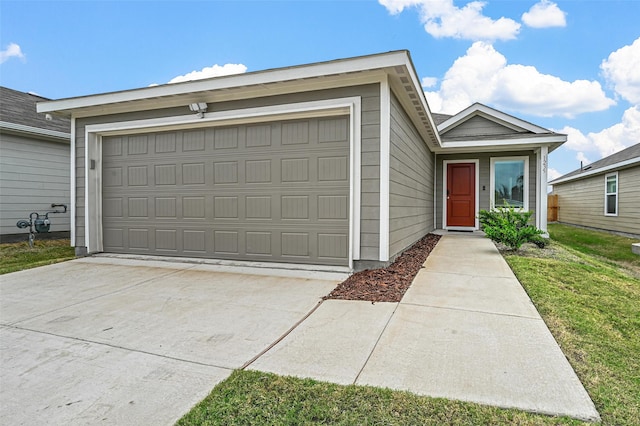 ranch-style house featuring a garage