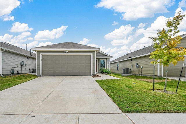 view of front of house with central air condition unit, a front yard, and a garage