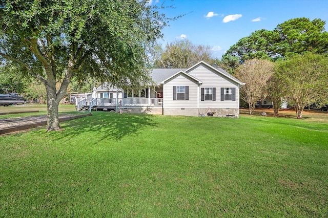 view of front of home with covered porch and a front yard