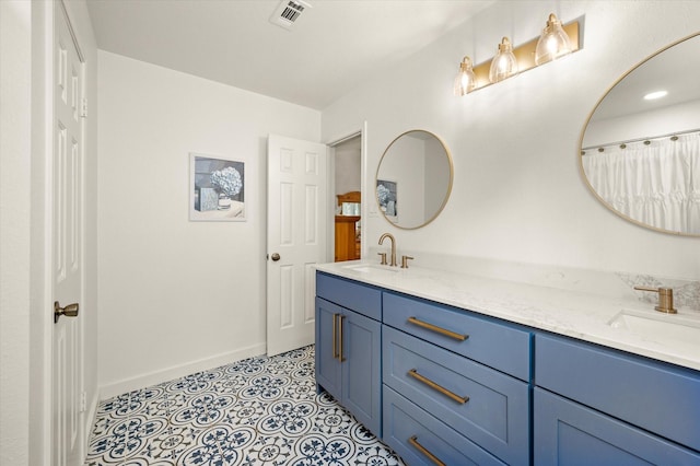 bathroom featuring tile patterned floors and vanity