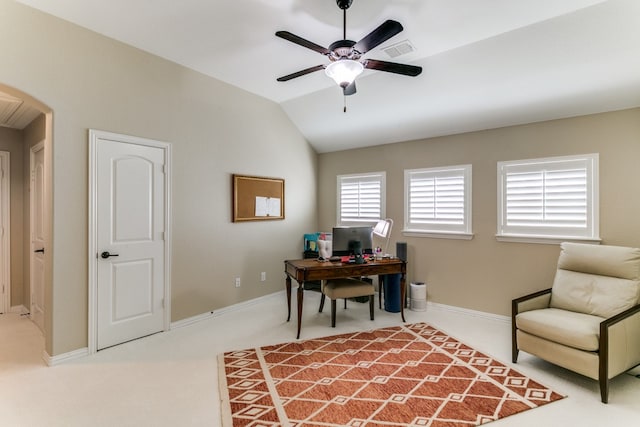 carpeted home office featuring ceiling fan and vaulted ceiling