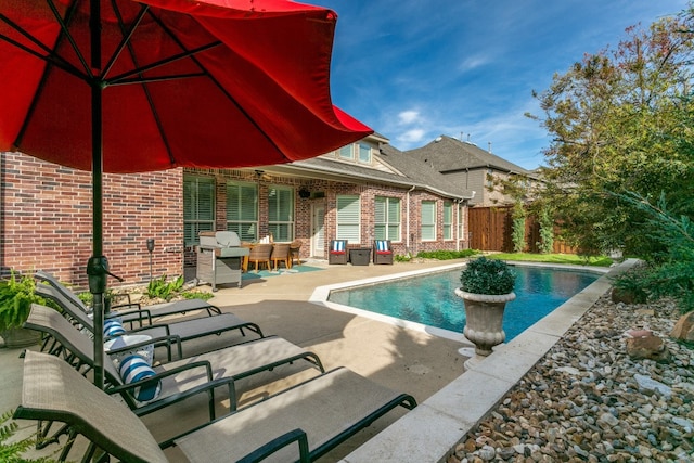 view of pool featuring a patio area