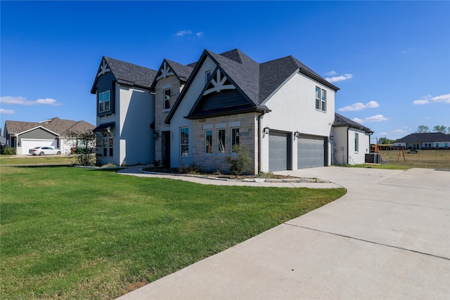 view of front of home featuring a front lawn and a garage