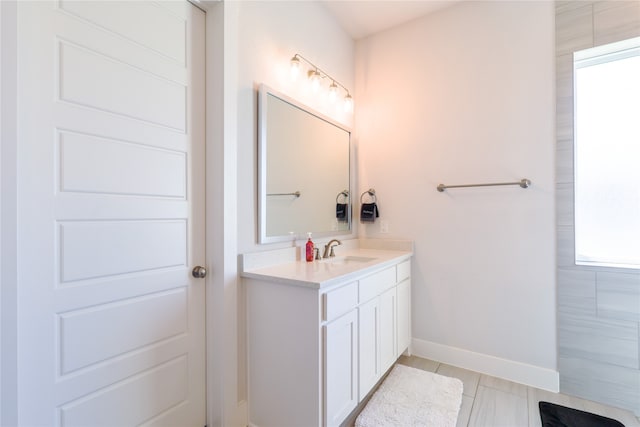 bathroom with vanity and plenty of natural light