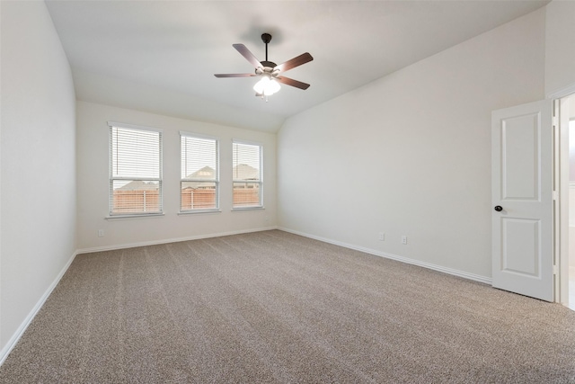 unfurnished room featuring lofted ceiling, carpet floors, and ceiling fan