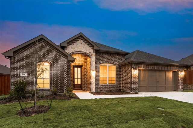 french country home with a garage