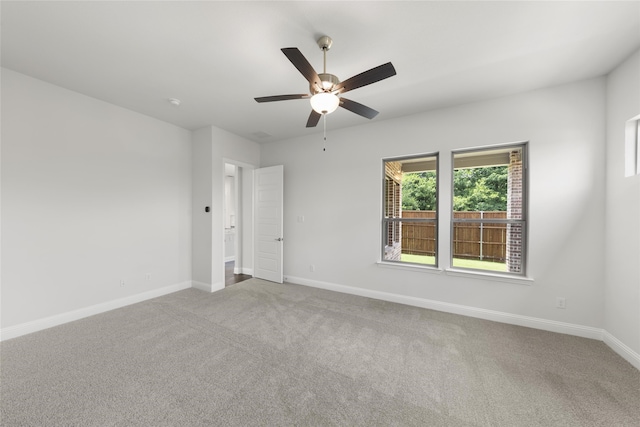 unfurnished room with light carpet and ceiling fan