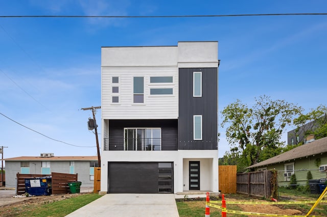 modern home featuring a balcony and a garage