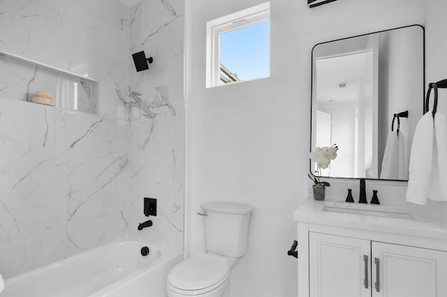 full bathroom featuring vanity, toilet, and tiled shower / bath