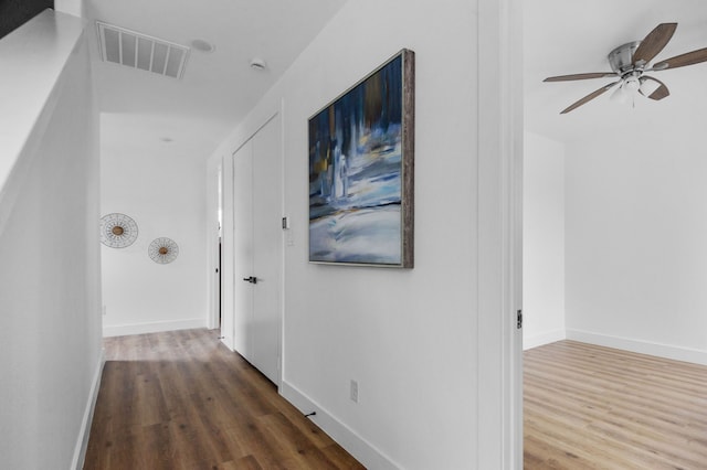 corridor featuring dark wood-type flooring