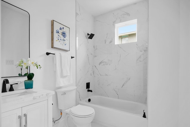 full bathroom with vanity, toilet, and tiled shower / bath