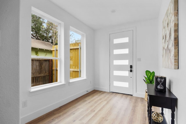 entryway with light hardwood / wood-style floors