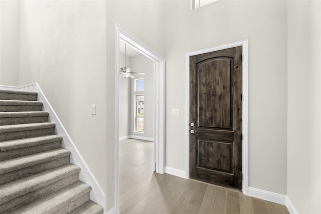 foyer entrance featuring light hardwood / wood-style floors and ceiling fan