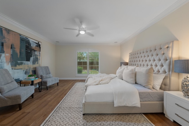 bedroom with crown molding, light hardwood / wood-style flooring, and ceiling fan