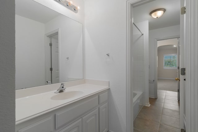 bathroom with vanity, tile patterned flooring, and tub / shower combination