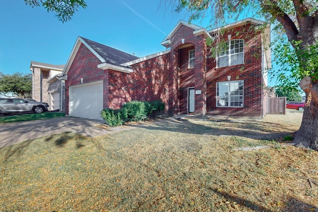 view of front of house featuring a front lawn and a garage