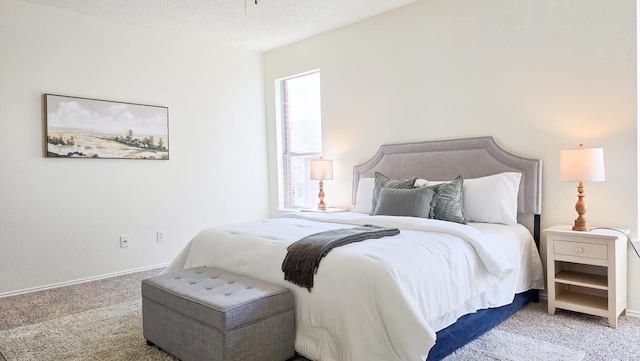 carpeted bedroom with a textured ceiling