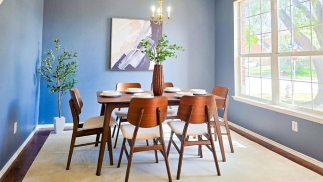 dining room featuring hardwood / wood-style floors, a notable chandelier, and plenty of natural light