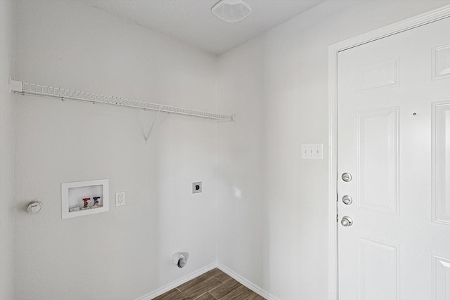 2121 Franks St, Fort Worth, TX 76177 - laundry area with hookup for a washing machine, hookup for an electric dryer, dark wood-style flooring, and baseboards