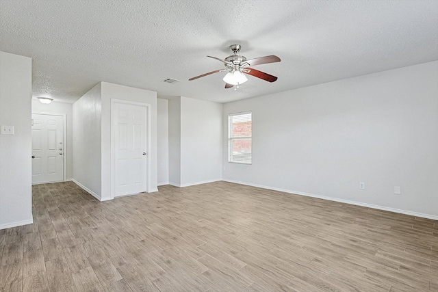 2121 Franks St, Fort Worth, TX 76177 - unfurnished room featuring a ceiling fan, light wood-type flooring, a textured ceiling, and baseboards