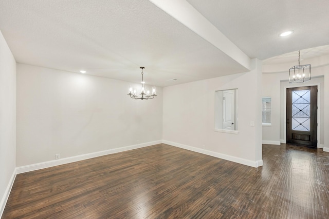 entryway with a chandelier, dark wood-style flooring, recessed lighting, and baseboards