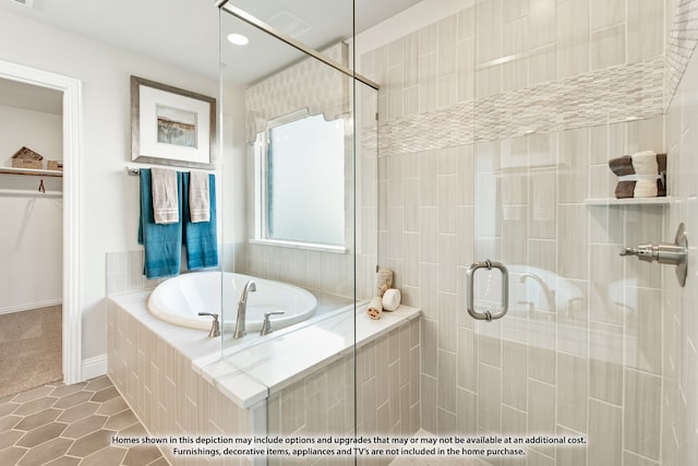 bathroom featuring plus walk in shower and tile patterned floors