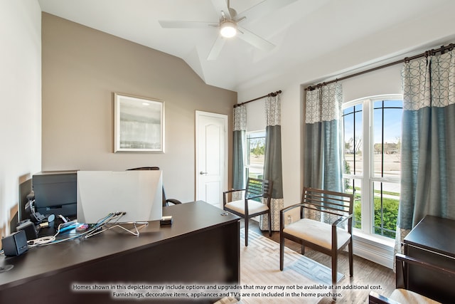 office with vaulted ceiling, a wealth of natural light, light hardwood / wood-style floors, and ceiling fan