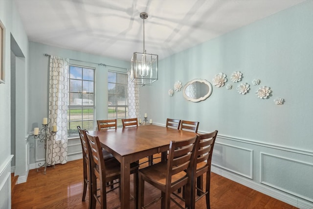 dining room with a chandelier and hardwood / wood-style floors