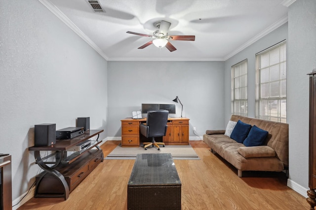 office space with ornamental molding, light hardwood / wood-style floors, and ceiling fan