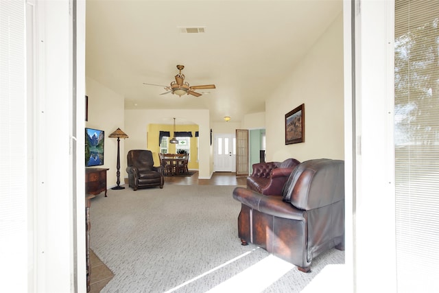 living room with ceiling fan