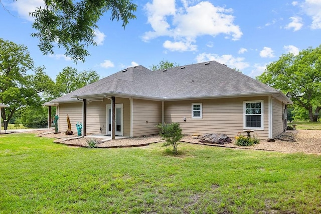 502 Smith Oak Rd, Sherman, TX 75090 - back of property featuring a yard, roof with shingles, and a patio area